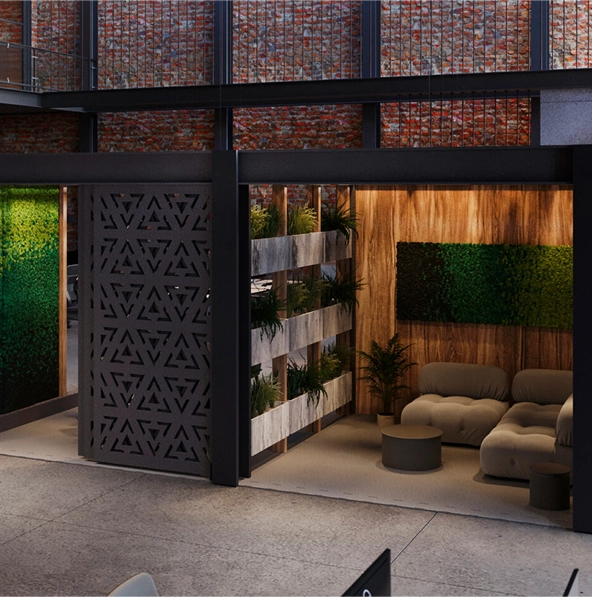 A modern office space with a vibrant green wall and a cozy couch, designed for acoustic comfort.