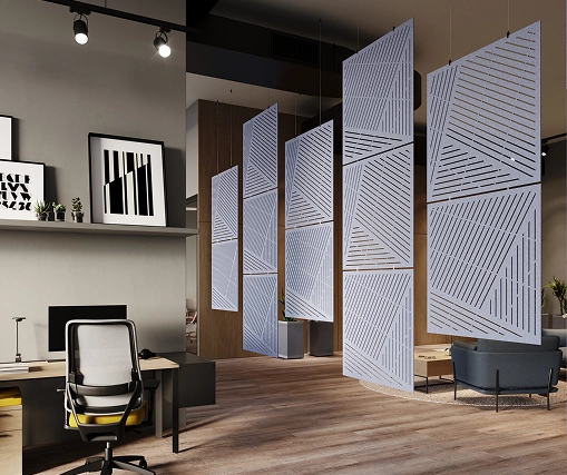 A workspace containing a desk, chairs, and a wall of acoustic panels designed to reduce noise.