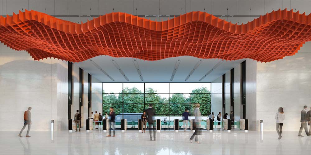 A large red sculpture hangs from the ceiling, surrounded by acoustical nets in a modern building interior.