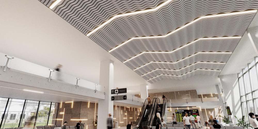 A large lobby with people moving about, showcasing a unique ceiling system.
