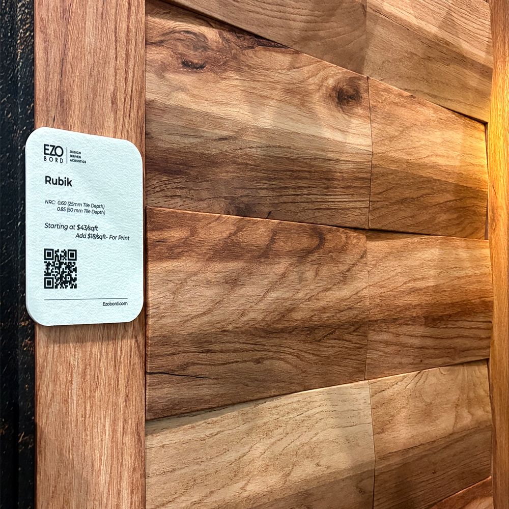 Wooden wall adorned with a tag, representing its role in providing acoustic solutions for noise control.